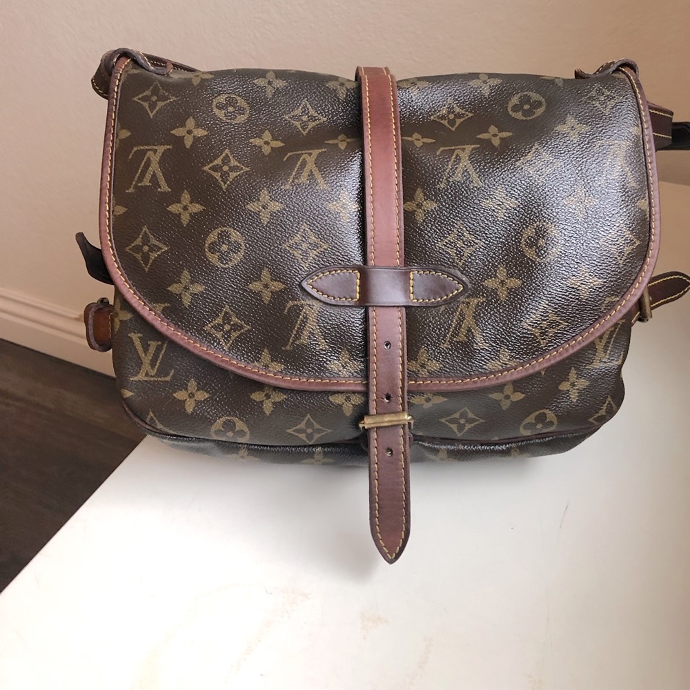 Original Louis Vuitton Side saddle cross body purse in good condition